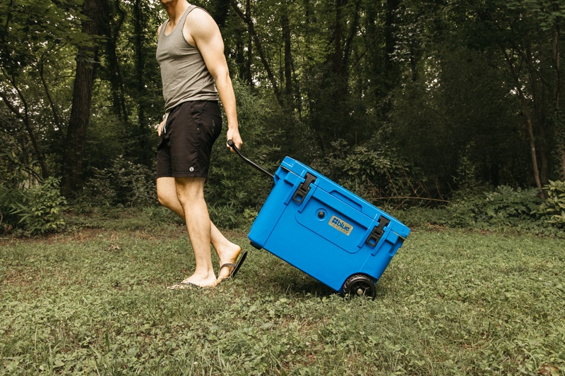 blue coolers walking with wheeled cooler