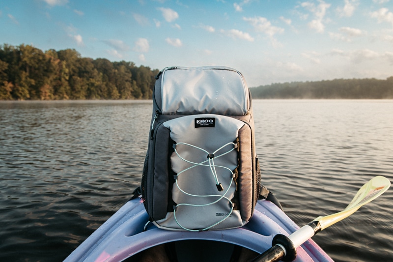 Igloo voyager backpack cooler on a kayak in lake